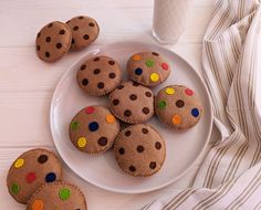 some cookies are sitting on a plate with polka dots