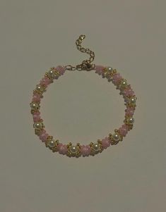 Handmade cutesy pearl and pink beaded bracelet.    The size of the bracelet (6in or 8in) is measured by the beaded part. All bracelets have an additional 2 inch gold plated chain. The bracelet clasp and chain is gold plated so it will not rust in contact with water. It is handmade so flaws may be a little visible. Adjustable Pink Pearl Bracelet With Spacer Beads, Handmade Pink Pearl Bracelet, Pink Dainty Pearl Bracelet, Pink Pearl Bracelet With Tiny Round Beads, Trendy Pink Beaded Chain Bracelets, Pink Pearl Jewelry With Tiny Beads, Trendy Pink Beaded Chain Bracelet, Handmade Dainty Pink Pearl Bracelet, Dainty Pink Pearl Bracelets