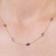 DETAILS Made to Order | Ships in 2-3 weeks The beveled chain of the Suncatcher Necklace glimmers on the skin, adorned with blueberry hued tanzanites. Like water drops after a summertime rain, the stones are designed to contour the collarbone. Adjustable necklace length 16”, 17”, 18” STONES Tanzanite MATERIALS Yellow Gold - 14K DESIGNED & HANDCRAFTED IN LOS ANGELES, CALIFORNIA Fine Jewelry Tanzanite Necklace, Tanzanite Briolette Necklace Gift, Gold Tanzanite Pendant Necklace, Classic Tanzanite Gemstone Necklaces, Tanzanite Faceted Necklace For Gift, Dainty Gold Necklace, Water Drops, Adjustable Necklace, Summer Jewelry