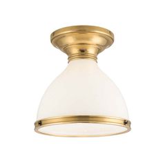 a light fixture with a white glass shade on the bottom and gold trimmings