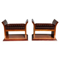 a pair of wooden benches sitting next to each other on top of a white background