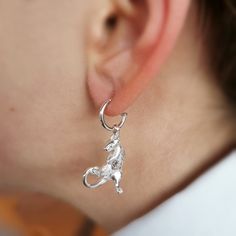 Rat Creole Earrings Rat Jewellery Our rat creole earrings feature a handmade rat charm with spectacular detail hanging from a hoop. It's a conversation starter you'll wear and wear, and won't see anywhere else. Full of cheeky charm, this little ratty is ready for some acrobatics. Just look at his tiny tail, cute little face, and realistic-looking fur. These special earrings are perfect as a rat lover gift, or if you heart rats. Our rat jewellery range was created by Jana to challenge people's negative ideas about rats. Rather than the sneaky, unfriendly way they are often portrayed, rats are highly sociable and loving, capable of forming relationships with each other and humans. If you're a pet rat owner or a massive rat fan, you can wear your fun-loving rat earrings with pride, and let ev Sterling Silver Dangle Earrings With Charms, Sterling Silver Drop Earrings With Charms, Sterling Silver Hoop Earrings With Dangling Charms As Gift, Elegant Sterling Silver Huggie Earrings With Dangling Charms, Elegant Sterling Silver Hoop Earrings With Dangling Charms, White Gold Earrings With Dangling Charms As Gift, White Gold Earrings With Dangling Charms For Gift, Sterling Silver Huggie Earrings With Dangling Charms As Gift, Rat Earrings