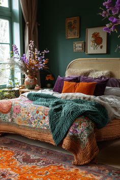 a bedroom with green walls and an orange rug on the floor next to a bed