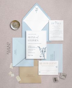 the wedding stationery is laid out and ready to be put into their guests'envelopes