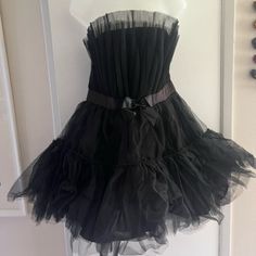 Women's Size = Xl Brand New! Zips Up The Side Near The Bust Very Puffy Petticoat Style (2 Layers Of Petticoat Material On The Skirt) Bow At The Waist Lining Underneath Skirt Strapless 15 1/2" Waist 16" Pit To Pit 8 1/4" Top Of Bust To Bottom Of Bust 18" Length Bottom Of Bust To Bottom Of Dress Skirt Sexy Mama! Black Strapless Coquette Dress, Elegant Black Petticoat For Party, Elegant Black Party Petticoat, Black Summer Petticoat For Costume Party, Black Fitted Petticoat For Party, Black Spring Petticoat For Costume Party, Black Petticoat For Costume Party In Spring, Black Petticoat For Spring Costume Party, Knee-length Party Petticoat