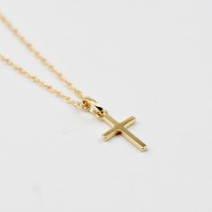 Solid Gold Cross Necklace. 14k cross pendant and necklace. This necklace is both elegant and beautiful. This is a beautiful necklace that is both timeless and precious. A great gift for graduation, communion or baptism. The necklace will arrive in a gift box, ready for delivery. The cross pendant is solid 14K gold, it is about 17mm x 10mm. 14K gold necklace All components are 14k gold Please read our policies before you place your order. https://www.etsy.com/shop/SashJewelry/policy?ref=shopinfo_ 14k Gold Cross Necklace For First Communion, Minimalist Cross Pendant Necklaces For Baptism, Minimalist Cross Pendant Necklace For Baptism, Classic Cross Pendant Necklace As Gift, Yellow Gold Cross Pendant Necklace For First Communion, 14k Gold Cross Pendant Necklace For First Communion, Yellow Gold Cross Necklace For First Communion, Minimalist Cross Pendant Necklace For First Communion, Classic Cross Pendant Jewelry For First Communion