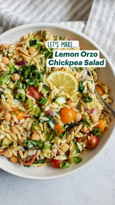 a white bowl filled with lemon orzo chickpea salad