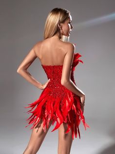 This sophisticated Eleri Strapless Sequin Feather Mini Dress is sure to turn heads. Constructed with a strapless cut, delicate feathers, and eye-catching sequins, it's a perfect choice for cocktail parties and other dressy occasions. An elegant mini-length ensures that your look is effortless and refined.    Material: 100% Polyester    Invisible zipper opening at the back   Stretch Factor:  Non   Stretch    Clean: Dry clean only    Color may vary due to the lighting on images. The product images Red Dress With Feathers, Alexa Aesthetic, Fire Makeup, Feather Mini Dress, Dress With Feathers, Wrapped Skirt, Fall Winter Dresses, Exclusive Dress, Hip Dress