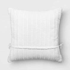 a white pillow on a gray background