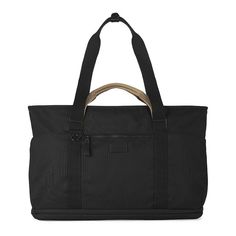 a black tote bag with handles and straps on the front, sitting against a white background