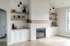 a living room filled with furniture and a fire place