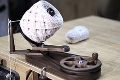 a ball of yarn is sitting on a sewing machine