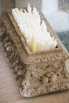 a close up of a toothbrush holder on a carpeted floor in front of a window