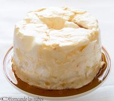 a cake with white frosting on a plate