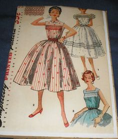 an old fashion book with two women's dresses on it