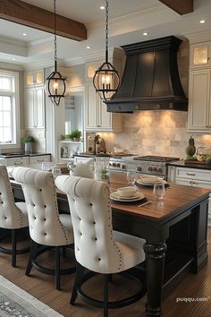 a large kitchen with an island in the middle and lots of chairs on top of it