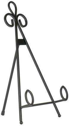 a black metal rack with two hooks on it's sides and an oval design