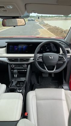 the interior of a car with dashboard and steering wheel