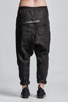 "Denim Drop Crotch Boiled Linen Trousers With Elastic Waistband__ // EXPRESS DELIVERY ONLY __Cropped Length __Asymmetrical Hidden Front Closure __Rear Bonded Panel __2 Front & 2 Rear Pockets __Elastic Waistband __Fully Completed Stitching model__ bust 92 (36\"), waist 72 (28\"), hips 102 (40\"), biceps 28 (11''), height 177 (5'8\"), kg 65 (143 lbs) model wears size M | color: black fabric__ 100 linen care__ dry cleaning do not bleach do not tumble dry do not iron to keep wrinkle effect sizin Black Tapered Bottoms For Spring, High Waist Black Linen Pants, Drop Crotch Bottoms With Side Pockets And Relaxed Fit, Black Linen Tapered Leg Bottoms, Fitted Black Linen Bottoms, Linen Bottoms With Belt Loops, Urban Clothing Men, High Collar Jacket, Black Linen Trousers