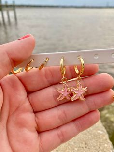 Starfish Huggies are perfect and there are multiple colors available! These hoops are hypoallergenic, nickel-free, and 18K gold plated so they are ideal for sensitive ears. Gold Starfish Earrings, Sea Star Earrings, Beach Earrings Aesthetic, Gold Beachy Jewelry, Beachy Gold Jewelry, Pink Starfish Charm Jewelry, Pink Star Jewelry With Starfish Charm, Pink Star-shaped Jewelry With Starfish Charm, Starfish Charm Hoop Earrings As Gift