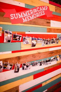 a wooden wall with pictures hanging from it's sides and the words summer camp memories written on them