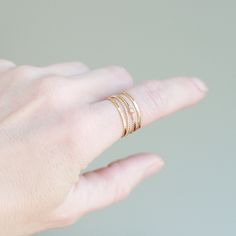 Ad a touch of sparkle to your stacking set with a tiny 2 mm cz diamond ring and three stacking bands. These four stack bands are super slim, hand formed, hammered and come made to order in US sizes 5 - 9! Our gold stacking rings are perfectly dainty for wearing alone, as a knuckle ring or as a set. We'll create your custom set of gold stacking rings in a mix-and-match of styles that you select from the drop-down menu. Combo shown in first image is the cz diamond with pebbled, twist and hammered Everyday Stackable Diamond Rings, Everyday Stackable Diamond Midi Rings, Everyday Diamond Stackable Midi Rings, Minimalist Stackable Diamond Midi Rings, Dainty Diamond Stackable Rings For Everyday, Delicate Stackable Rings With Rose Cut Diamonds, Dainty Everyday Diamond Stackable Rings, Delicate Diamond Stackable Rings For Everyday, Dainty Adjustable Stackable Diamond Ring