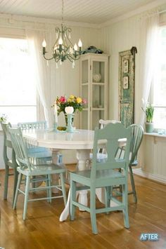 a dining room table with chairs and a chandelier