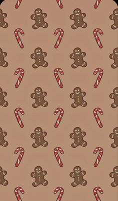 a brown background with candy canes and gingerbreads