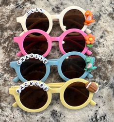 The cutest custom sunglasses for kids! Dinosaur, sports, or flower beads available! All sunglasses are made custom and to order. Customizable Fun Plastic Sunglasses, Fun Personalized Plastic Sunglasses, Playful Customizable Adjustable Sunglasses, Sunglasses For Kids, Custom Sunglasses, Sport Sunglasses, Flower Beads, Kids Sunglasses, Sports Sunglasses