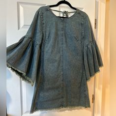 You Will Feel Like A Denim Princess In This Cute Free People Dress. The Sleeves Are Magic. Size 10 But Could Fit An 8. Dress Up With Fun Belt And Boots Or Just Let It Drape On Your Body With The Wonderful Low Back Cut In The Back. Spring Dark Wash Dress With Frayed Hem, Fall Denim Dresses With Frayed Hem, Dark Wash Dress With Frayed Hem For Spring, Dark Wash Long Sleeve Washed Dress, Cotton Long Sleeve Dress With Frayed Hem, Long Sleeve Cotton Dress With Frayed Hem, Fitted Spring Dress With Frayed Hem, Medium Wash Mini Dress With Frayed Hem For Spring, Fitted Dress With Frayed Hem For Spring