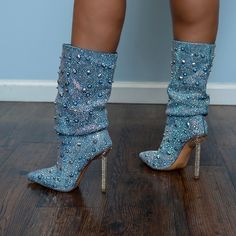 This Fierce Bootie Is Made From A Washed Denim Upper And Features A Mid Calf-Height Shaft, A Slightly Slouched Design, A Cushioned Insole, A Pointed Toe Silhouette, Scattered Iridescent Rhinestone And Spike Detailing, And A Rhinestone-Detailed Metal Stiletto Heel. Complete With A Slip-On Fit. Brand New. In Original Box. Heel Height Approximately 4.25” Light Blue Party Boots For Fall, Blue Boots For Night Out In Spring, Blue Boots For Spring Night Out, Blue Rhinestone Boots For Spring, Spring Blue Boots With Rhinestones, Blue Rhinestone Boots For Fall, Fitted Denim Boots For Party, Fitted Light Blue Party Boots, Trendy Blue Boots With Rhinestones