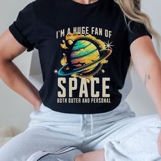 Get ready to blast off into style with our space shirt collection! Whether you're an outer space fanatic or just love cute cosmic designs, our Pluto 'Never Forget' tee is perfect for showing your planetary pride. Explore the universe in comfort with our adorable space-themed t-shirt featuring galaxies, planets, and more. It's the ultimate graphic tee for anyone who dreams of interstellar adventures! PRODUCT DETAILS This classic unisex jersey short sleeve tee fits like a well-loved favorite. Soft Cosmic Outfit, Galaxy Planets, Tshirt Painting, Space Outfit, Space Shirts, Aesthetic Shirts, Teacher Outfits, Personal Space, Shirt Collection