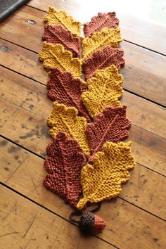 a knitted leaf is laying on the floor