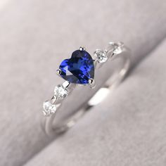 ◆ The ring is handcrafted from sterling silver and decorated with a dazzling 6*6 mm lab Sapphire and tiny CZs. It is suitable for engagement/anniversary/daily occasion. ◆ Production Description: Main stone Type: Lab Sapphire Main Stone Shape: Heart cut Main Stone Size: 6*6 mm(1.13 ct) Side stone: CZ Metal: 925 Sterling silver - Other options available in the drop down menu ◆ Customization: √Free for Add Engraving √Other Metal Type Available √Other Gemstones & Shapes Available √Personalizatio Delicate Promise Rings, Promise Rings Sapphire, Diamond White Sapphire Promise Ring, Sterling Silver Heart Crystal Promise Ring, Dazzling Cubic Zirconia Birthstone Ring As Gift, Sapphire Birthstone Ring With Brilliant Cut For Gift, Sapphire Diamond Birthstone Ring As Gift, Sapphire Birthstone Ring With Diamonds As A Gift, Heart Cut Sapphire Promise Ring