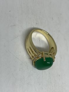 Vintage Lucky Green Nephrite Jade Gold Filled Cocktail Ring Large green nephrite jade gold filled Vintage ring, does not tarnish Size 5.5, 6, 7, 7.5, 8 All rings are shipped free in the US in a nice gift box. Check out our over a THOUSAND great reviews Engraving is $4 per letter and is not always perfect depending on the piece. It can take a few days if the jeweler is busy. This is payable to Paypal Judithsltd@gmail.com Green Hallmarked Open Ring, Green Cabochon Fine Jewelry Rings, Green Cabochon Rings Fine Jewelry, Fine Jewelry Gold Jade Rings, Gold Jade Rings In Fine Jewelry Style, Fine Jewelry Gold Rings With Jade, Formal Gold Jade Rings, Formal Jade Rings For May Birthstone, Gold Jade Emerald Ring