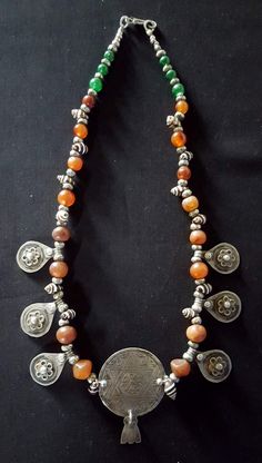 Morocco - Beautiful silver necklace "JUDAICA" made with carnelian, silver, and shell beads This necklace was made by Moroccan Jewish artisans of the middle-atlas in the year 1940. Early 20th century The central plate measures in diameter 4 cm The total length of the necklace is 28 cm Bohemian Silver Carnelian Necklaces, Silver Carnelian Bohemian Necklace, Silver Carnelian Bohemian Necklaces, Silver Beaded Amulet Necklace, Silver Amulet Style Beaded Necklace, Silver Gemstone Beads Amulet Jewelry, Silver Amulet Jewelry With Gemstone Beads, Traditional Silver Carnelian Necklace, Silver Beaded Carnelian Necklace