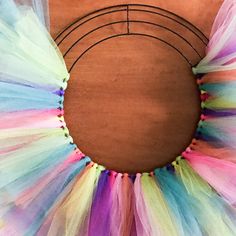 a close up of a colorful tulle wreath