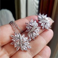 White Cubic Zirconia Jewelry With Rhinestones, Sparkling White Crystal Jewelry, White Crystal Jewelry Sets As Gift, White Crystal Jewelry Sets For Gift, Dazzling White Jewelry Set With Sparkling Stones, White Crystal Jewelry With Diamond Cut, Dazzling White Sterling Silver Jewelry Sets, White Diamond-cut Crystal Jewelry, White Cubic Zirconia Jewelry Sets For Party