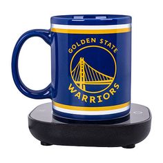 a golden state warriors coffee mug on a coaster