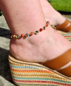 - D E T A I L S - Add a pop of color to your summer look with this colorful anklet. Using sand brown cord, I macramed 6mm orange hued Agate with 4mm Poppy Jasper. Tiny glass seed beads add color and a fun edge around the Jasper. Macrame allows me to add texture. It's also sturdy and will not stretch.  Two loops make this adjustable with fits at 10-1/2 and 11" long. A delightful poppy orange glass flower button adds to the boho style.  Thank you for supporting handmade at Heart in Hand Designs.  - C O N N E C T - for news on designs and events, visit me on the socials: ♥ instagram @heartinhanddesigns ♥ facebook.com/heartinhanddesignsLLC Colorful Beads Anklet For Festival, Adjustable Multicolor Beaded Anklets, Bohemian Beaded Anklet Bracelet For Festivals, Multicolor Summer Anklets As Gift, Bohemian Multicolor Anklets With Colorful Beads, Bohemian Multicolor Beaded Anklets, Multicolor Beach Anklets, Casual Handmade Multicolor Anklets, Adjustable Multicolor Anklets For Vacation