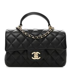 This is an authentic CHANEL Lambskin Quilted Mini Top Handle Rectangular Flap in Black. This chic mini cross body classic is crafted of quiltedlambskin leather in black. The bag features a leather top handle, a gold chain link leather threaded shoulder strap and a facing gold Classic CC turn lock. This opens the flap to a black leather interior with pockets. Chanel Mini Rectangular, Chanel Top, Chanel Mini, Mini Cross, Mini Top, Leather Thread, Leather Interior, Lambskin Leather, Leather Top