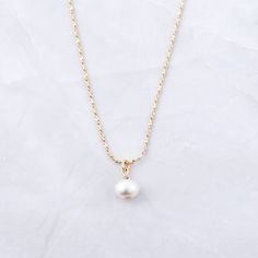 The ultimate symbol of elegance - PEARLS! They are trendy & a beautiful way to add a feminine touch to your outfit! The diamond cut design on the chain also makes the chain sparkle - adding a niced touch! Made of 925 Sterling Silver THICK plating of 14k Gold Made of Freshwater Pearls 16" + 3" Ext Chain Pendant : 6mm Nickel-free & Hypoallergenic Lobster Clasp Closure White Pearl Charm Chain Necklace For Formal Events, White Chain Necklace With Pearl Charm For Formal Occasions, White Classic Necklace With Delicate Chain, Classic White Necklace With Delicate Chain, Formal White Chain Necklace With Pearl Charm, Gold-plated Jewelry With Pearl Charm, Elegant Gold Plated Cable Chain Jewelry, Elegant Gold-plated Jewelry With Cable Chain, Everyday White Gold Necklace With Pearl Charm