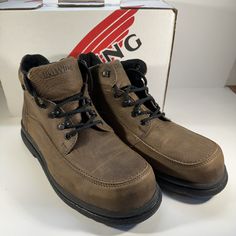 Elevate Your Workwear Game With These Red Wing Chukka Boots. Crafted With High-Quality Leather And A Durable Steel Toe, These Boots Are Perfect For Any Construction Site. The Ankle Shaft Style And Hook & Loop Closure Provide A Comfortable And Secure Fit, While The Leather Outsole Ensures Excellent Traction. These Brown Boots Are Not Only Functional But Also Stylish, With A Classic Chukka Design That Can Be Worn For Any Occasion. The 06662-2 Model Is Available In Uk Shoe Size 10.5, Us Shoe Size 1 Brown High-top Waterproof Boots For Work, Workwear Ankle-high Boots With Reinforced Toe, Ankle-high Work Boots With Reinforced Heel, Formal Lace-up Boots With Reinforced Toe, Round Toe Work Boots With Rubber Sole, Red Round Toe Workwear Boots, Red Round Toe Work Boots, Work Boots With Round Toe For Workwear, Red Round Toe Boots For Work