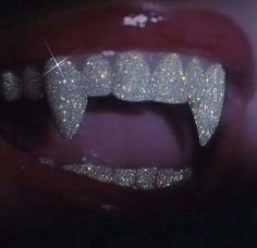 a person's mouth with glitter on it