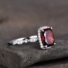 This is a Garnet & cubic zircon ring in 925 sterling silver. This ring is marked 925 Main stone is 6x8mm cushion cut,about 2.0ct. If you want a matching band,see: www.etsy.com/listing/478773020/sterling-silver-ring www.etsy.com/listing/481834168/sterling-silver-ring I accept custom making order.Please contact me if you need this service. All the jewelry in my store is handmade.It may take 5-7 weeks to finish. For all the jewelries,there is a 14 days money back guarantee.You can return it in Red Sapphire Engagement Ring, Red Gemstone Ring, Garnet Engagement Ring, Red Garnet Ring, Gold Anniversary Rings, Red Sapphire, Sapphire Wedding Band, Opal Wedding Rings, Ring Cushion