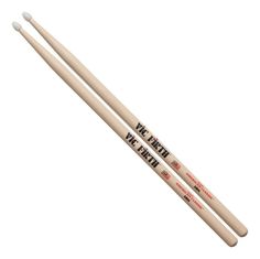 two drumsticks with the words we're here on them, and one is in