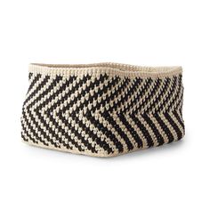 a black and white basket on a white background