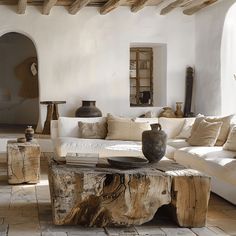 Rustic Mediterranean living room with a focus on incorporating wooden coffee and side tables for added warmth Wabi Sabi Couch, Neutral Coastal Living Room, Wabi Sabi Living, Modern Hacienda, Earthy Living Room, Modern Boho Living Room