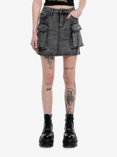 Yes! A skirt with pockets! Elevate your look with this grey denim skirt! It has front and back pockets  plus cargo pockets on the side with strap detailing.Please note: This style is fitted with no stretch; size up for a looser fit.75% cotton; 23% polyester; 2% spandexWash cold; dry flatLength: 16''ImportedListed in junior sizesModel is 5'10''Model wears size Small Ripped Jean Skirt Outfits, Edgy Cargo Skirt With Pockets For Streetwear, Edgy High-waist Denim Skirt With Pockets, Edgy Streetwear Mini Skirt With Pockets, Edgy Mini Skirt With Pockets For Streetwear, Denim Cargo Skirt With Utility Style, Utility Denim Skirt With Side Pockets, Denim Cargo Utility Skirt, Utility Denim Skirt With Pockets