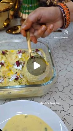 a person is spooning some food into a bowl